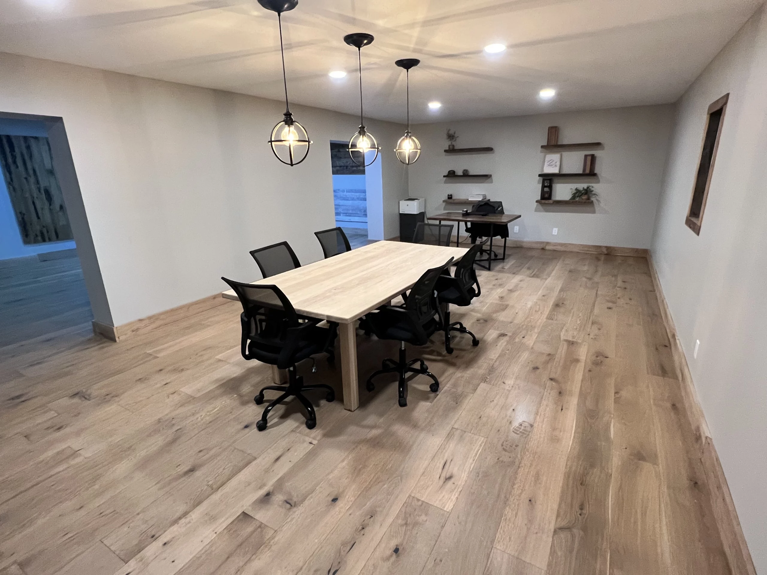 Meeting room featuring reclaimed wood flooring and wood accents