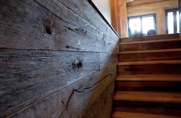 Wooden stairs with gray Tongue & Groove on the side