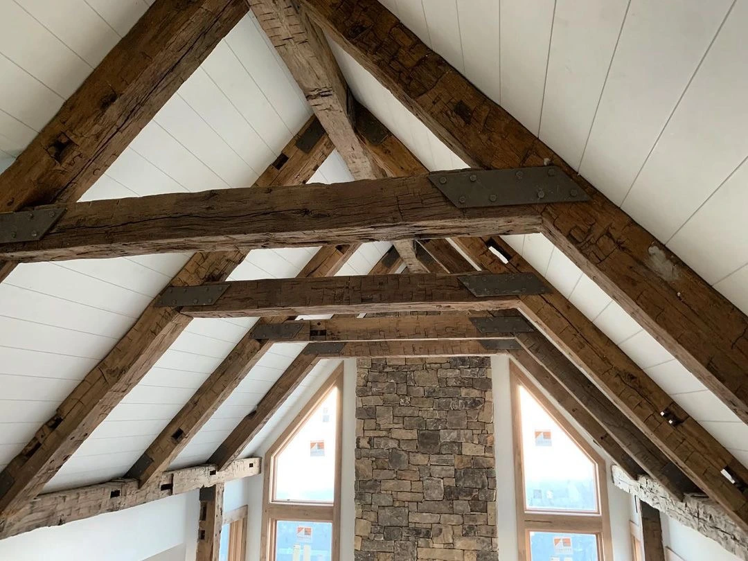 A room with wooden beams in the ceiling.