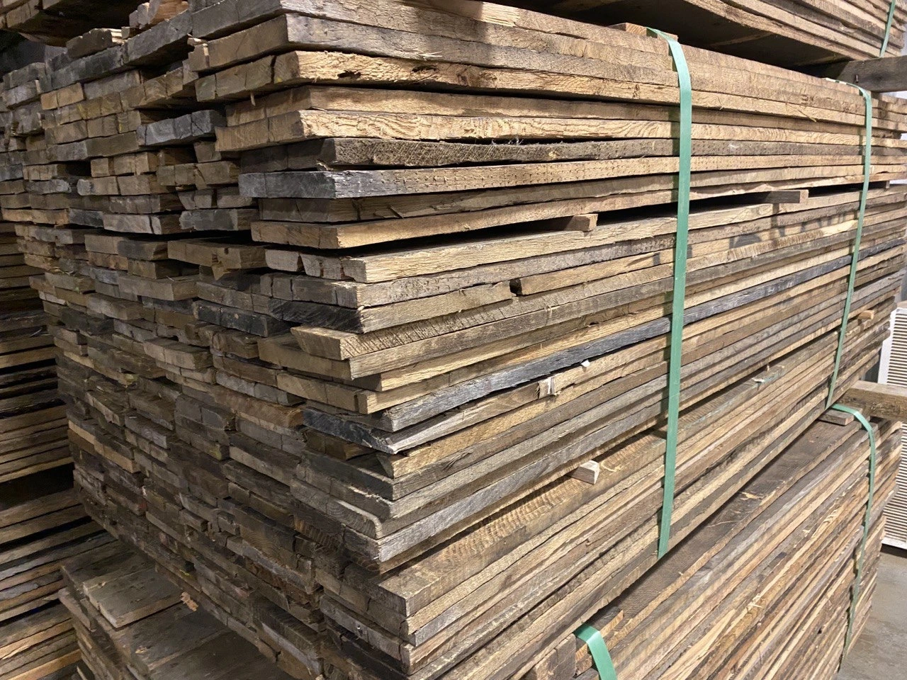 A stack of wooden planks in a warehouse.