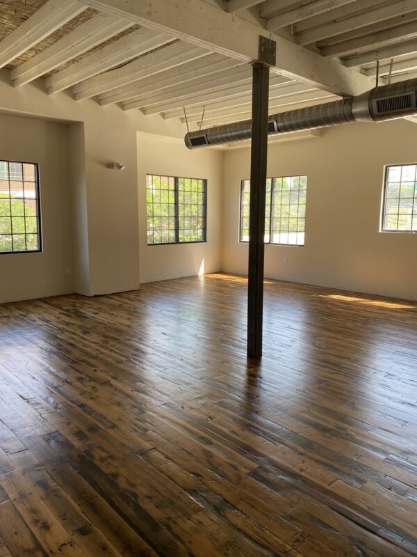 An empty room edgefield mixed hardwoods floor and windows