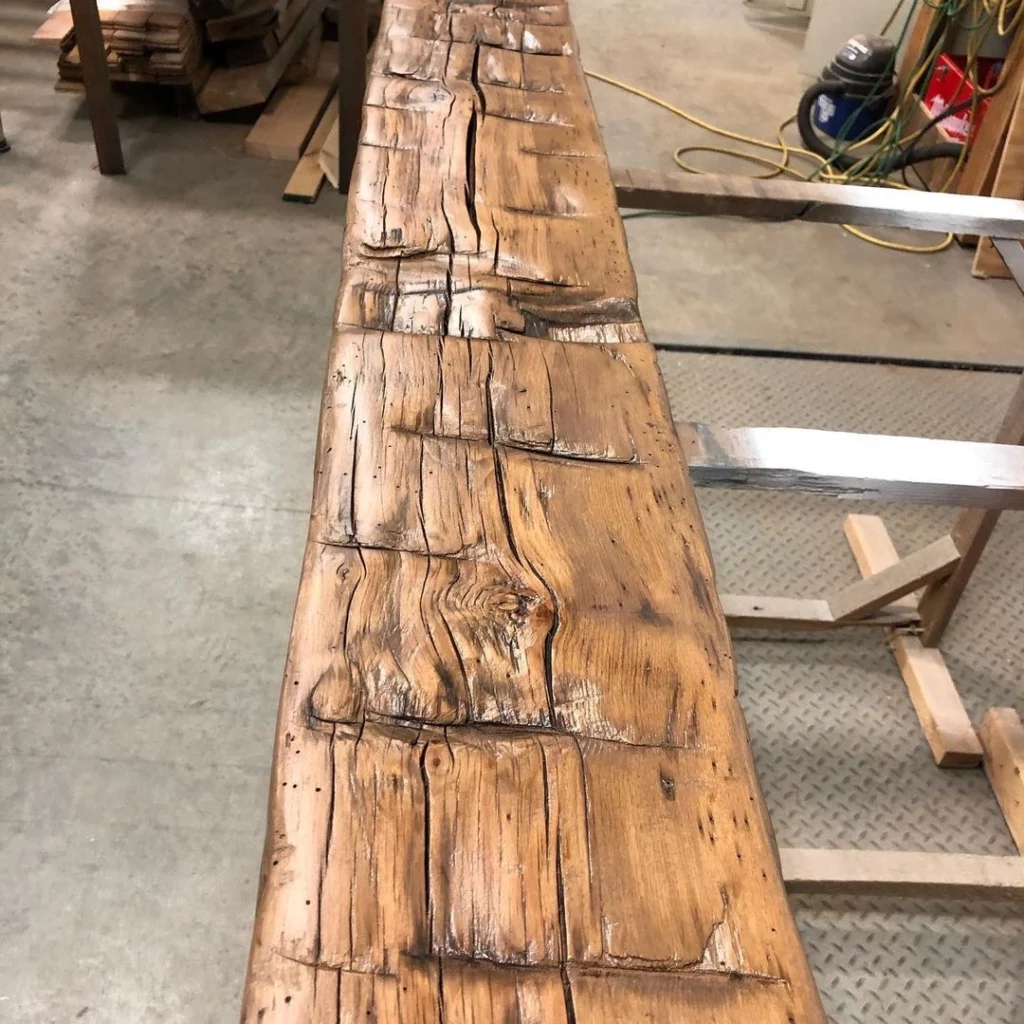 A piece of wood that is being made into a table.
