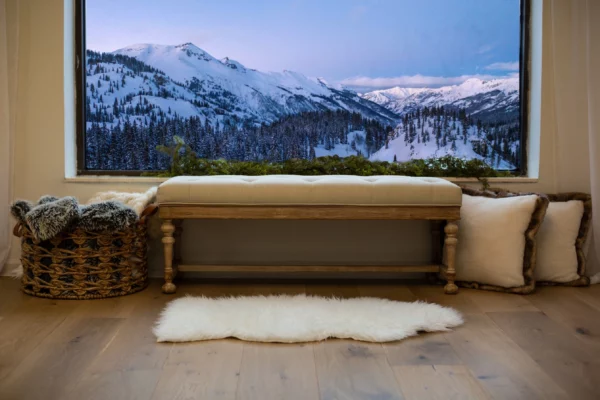 A bench on an engineered European oak floor in front of a picture of the mountains