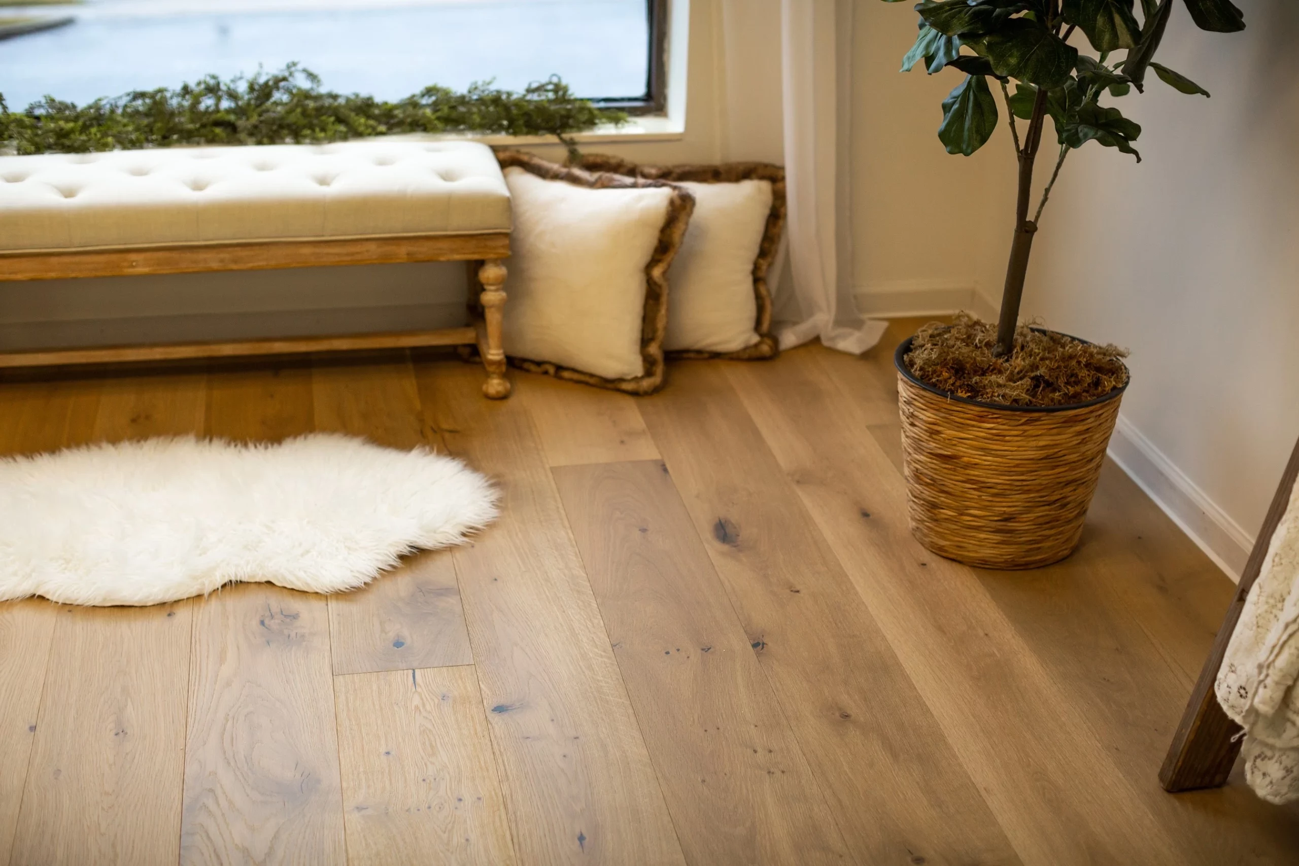 A living room with an engineered Euro oak floor and a sheepskin rug.