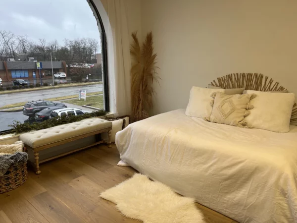 A cozy bedroom with engineered European oak flooring and a view on the street