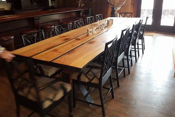 Reclaimed wood table and black chairs