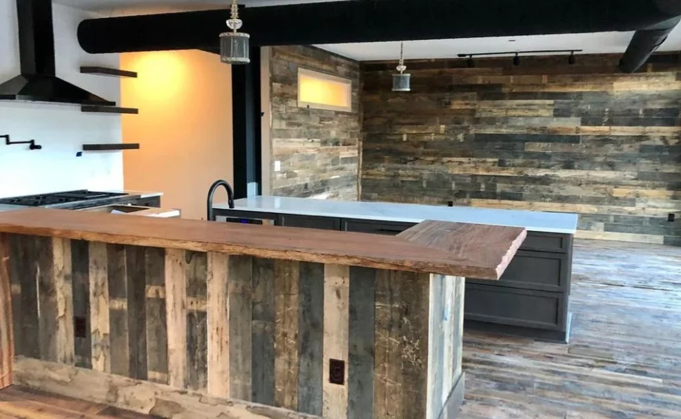 A kitchen with a wooden bar and a wooden counter top.